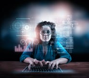 Woman working on laptop with a futuristic infograph royalty free stock images Woman working on laptop with a futuristic infograph royalty free stock images