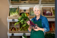 Woman working in small grocery store stock photo Woman working in small grocery store stock photo
