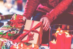 Woman Wrapping and Decorating Christmas Present at Home royalty free stock photography Woman Wrapping and Decorating Christmas Present at Home royalty free stock photography