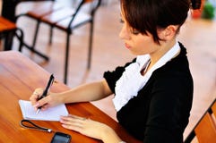 Woman Writing Something To The Notebook Using Pen Royalty Free Stock Photo