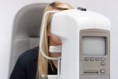 Man checks his vision on the machine. health care, medicine, people, eyesight and technology stock images Man checks his vision on the machine. health care, medicine, people, eyesight and technology stock images