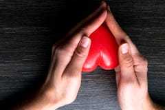women hands, holding red heart, giving to someone stock photography women hands, holding red heart, giving to someone stock photography