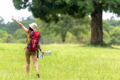 Women hiker or traveler with backpack adventure holding map to find directions and walking relax in the jungle forest outdoor for royalty free stock photos Women hiker or traveler with backpack adventure holding map to find directions and walking relax in the jungle forest outdoor for royalty free stock photos