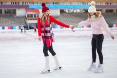 Women ice skating outdoor at ice rink stock images Women ice skating outdoor at ice rink stock images