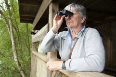 Women Looking Through Binoculars Royalty Free Stock Images
