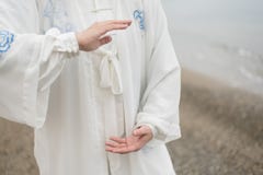 Women practicing Taijiquan on the beach Royalty Free Stock Images