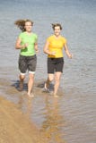 Women Running In Water Royalty Free Stock Image