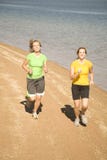 Women Running On Beach Royalty Free Stock Photo