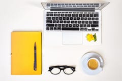 Women`s Home Office Desk. Workspace With Laptop, Computer, Yellow Notebook, Fashion Glasses, Cup Of Coffee And Flower Isolated On Royalty Free Stock Photos