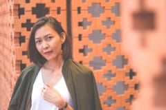 Women are standing against the brick wall stock photography Women are standing against the brick wall stock photography