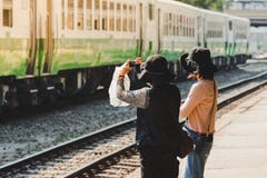 Women take photo of old trains in the train station royalty free stock photos Women take photo of old trains in the train station royalty free stock photos