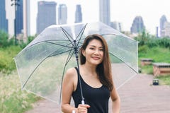 Women walking the umbrella in the park royalty free stock image Women walking the umbrella in the park royalty free stock image