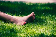Womens legs on grass royalty free stock image Womens legs on grass royalty free stock image