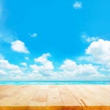 Wood Table Top On Blue Sea & Sky Background Royalty Free Stock Photos