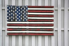 Wooden American Flag on fence stock photo Wooden American Flag on fence stock photo