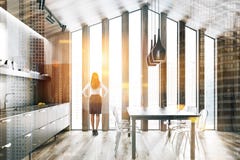 Wooden attic kitchen with table, woman royalty free stock photos Wooden attic kitchen with table, woman royalty free stock photos
