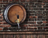 Wooden bar counter with beer barrel in the background Stock Image Wooden bar counter with beer barrel in the background Stock Image