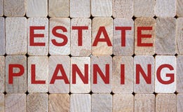 Wooden blocks form the words `estate planning`. Beautiful wooden background