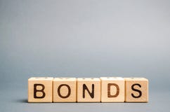 Wooden blocks with the word Bonds. A bond is a security that indicates that the investor has provided a loan to the issuer. stock photos Wooden blocks with the word Bonds. A bond is a security that indicates that the investor has provided a loan to the issuer. stock photos