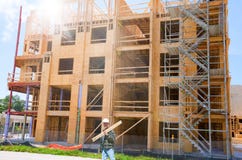 Wooden Building Under Construction With Worker Stock Photo Wooden Building Under Construction With Worker Stock Photo
