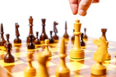 Wooden chess pieces on a chessboard Royalty Free Stock Photography Wooden chess pieces on a chessboard Royalty Free Stock Photography