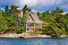 Wooden cottage on the lake stock images Wooden cottage on the lake stock images