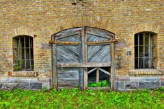 Wooden door in brick wall Wooden door in brick wall