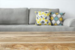 Wooden empty table in front of Living room sofa interior stock photo Wooden empty table in front of Living room sofa interior stock photo