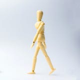Wooden figure doll with walking action for business concept on w royalty free stock images Wooden figure doll with walking action for business concept on w royalty free stock images