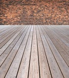 Wooden Floor And Brick Wall Stock Photos