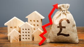 Wooden houses and a money bag with an up arrow. The concept of increasing the cost of housing. The growth of rent and mortgage