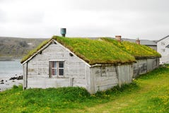 Wooden Houses With Green Roofs In Hamningberg. Stock Photos
