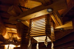 Wooden light chandelier at a ceiling LAtvia stock photo Wooden light chandelier at a ceiling LAtvia stock photo