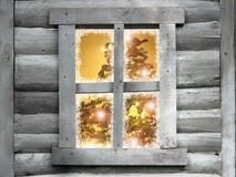 Wooden lodge window with christmas tree royalty free stock image Wooden lodge window with christmas tree royalty free stock image