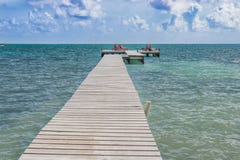 Wooden pier dock and ocean view at Caye Caulker Belize Caribbean royalty free stock photography Wooden pier dock and ocean view at Caye Caulker Belize Caribbean royalty free stock photography