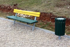 Wooden public bench with same style trash can Royalty Free Stock Images Wooden public bench with same style trash can Royalty Free Stock Images