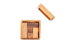 A wooden puzzle is a cube. Isolated on white background. Close-up. stock photo A wooden puzzle is a cube. Isolated on white background. Close-up. stock photo