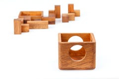 A wooden puzzle is a cube. Isolated on white background. Close-up stock photo A wooden puzzle is a cube. Isolated on white background. Close-up stock photo