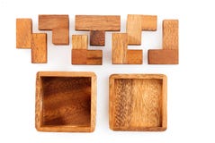 A wooden puzzle is a cube. Isolated on white background. Close-up. royalty free stock photography A wooden puzzle is a cube. Isolated on white background. Close-up. royalty free stock photography