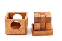 A wooden puzzle is a cube. Isolated on white background. Close-up. royalty free stock photo A wooden puzzle is a cube. Isolated on white background. Close-up. royalty free stock photo