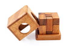 A wooden puzzle is a cube. Isolated on white background. Close-up. royalty free stock photo A wooden puzzle is a cube. Isolated on white background. Close-up. royalty free stock photo