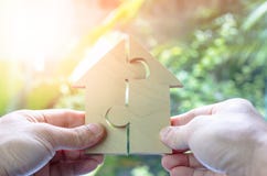 Wooden puzzle wait to fulfill home shape for build dream home or happy life concept for property, mortgage and real estate investm royalty free stock photo Wooden puzzle wait to fulfill home shape for build dream home or happy life concept for property, mortgage and real estate investm royalty free stock photo