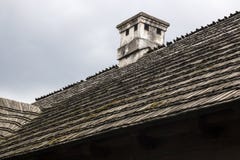 Wooden roof with chimney an old rural house royalty free stock image Wooden roof with chimney an old rural house royalty free stock image