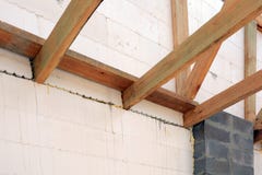 The wooden structure of the building. Installation of wooden beams at construction the roof truss system of the house. royalty free stock photos The wooden structure of the building. Installation of wooden beams at construction the roof truss system of the house. royalty free stock photos