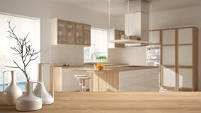Wooden table top or shelf with minimalistic modern vases over blurred minimalist modern kitchen, white architecture interior desig