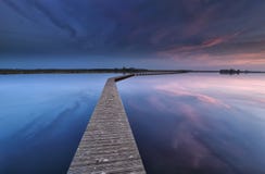 Wooden walkpath on water at dawn stock photography Wooden walkpath on water at dawn stock photography