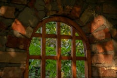 Wooden window of a red brick bungalow in the garden royalty free stock photography Wooden window of a red brick bungalow in the garden royalty free stock photography