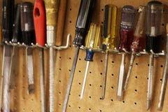 Woodworking tools hanging on a pegboard Royalty Free Stock Photo Woodworking tools hanging on a pegboard Royalty Free Stock Photo