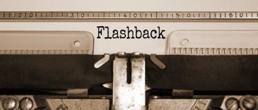Word `flashback` typed on retro typewriter. Sepia effect. Business concept