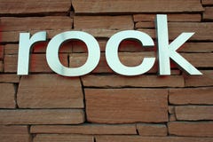 The Word Rock Written In Grunge Cutout Style Stock Vector